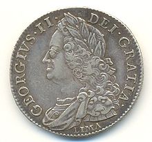 Coin showing George facing left