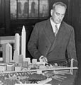 Image 2Robert Moses with a model of his proposed Battery Bridge, never built (from History of New York City (1898–1945))