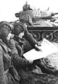 Image 5Soldiers in an East German tank unit reading about the erection of the Berlin Wall in 1961 in Neues Deutschland (from Newspaper)