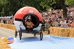 A participant to the race held in Alexandra Palace, London (2017) driving through the course on a Pokémon-inspired soapbox: creativity plays a huge role in the competition, as the style of every single vehicle is inspired by folklore, pop culture or everyday-life themes.