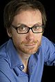 Image 2 Stephen Merchant Photo: Carolyn Djanogly Stephen Merchant (b. 1974) is an English writer, director, radio presenter, comedian, and actor. He is best known for his collaborations with Ricky Gervais, with whom he co-wrote and co-directed the popular British sitcom The Office, co-hosts The Ricky Gervais Show, and co-wrote, co-directed, and co-starred in Extras. More selected portraits