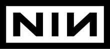 The letters N, I, and a backwards N set in a strong typeface within a simple black border.