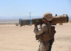 A US Marine carrying a BTM-71E practice round