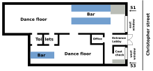 An illustration of the layout of the Stonewall Inn in 1969:. The floor layout is rectangular, with the front of the inn along Christopher Street. The entrance opens to a lobby where patrons could go to the larger part of the bar to the right that also featured a larger dance floor. From that room was an entrance to a smaller room with a smaller dance floor and smaller bar. The toilets are located near the rear of the building