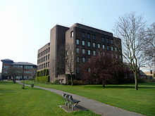 a six-storey building with a dark-brown brick veneer.