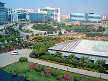 City panorama showing gardens, clean roads and modern office buildings