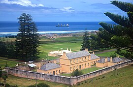 Old Military Barracks, served as Legislative Assembly Chambers from 1979-2015, with Kingston Common in background