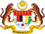 Shield showing the symbols of the Malaysian states with a star and crescent above and a motto below, supported by two tigers