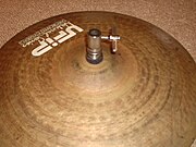 The same clutch installed on a top hi-hat cymbal