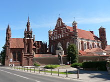 Exterior of two old, red churches