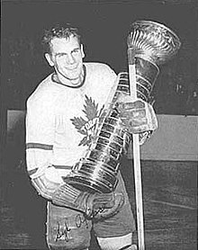 Syl Apps skating with the Stanley Cup.