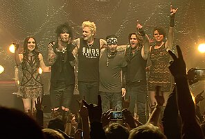 Sixx:A.M. in 2015. From left to right: Melissa Harding, Nikki Sixx, James Michael, DJ Ashba, Dustin Steinke and Amber Vanbuskirk