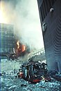 6 WTC on fire during the September 11 attacks, visible behind 7 WTC and its footbridge.