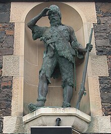 Bronze statue of Selkirk located in a stone alcove