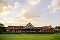 Back of the clubhouse from the practice putting green.