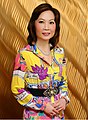 Image 149Jing Ulrich, a prominent global leader in finance, wearing brightly colored 1980s-inspired dress, 2012 (from 2010s in fashion)