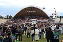 An outdoor stage and a crowd