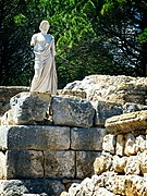 Reproduction of the statue of Aesclepius on the remains of a Greek rampart