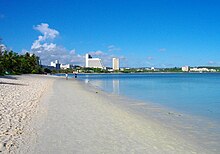 Beach, with modern buildings in the background