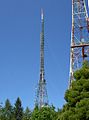 Transmission towers. Note that the upper parts of the tower in the background are guyed.