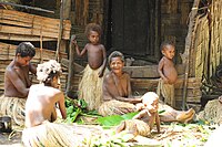 Yaohnanen women cooking and supervising their children