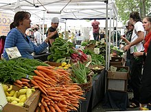 A vegetable vendor in a marketplace.