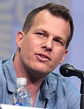 Jonathan Nolan looking to his left