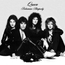 The four members of the band sit together in front of a sandy-coloured background wearing predominantly black clothing. Mercury appears to be the dominant figure, sat in front of the other three members. From left to right, John Deacon, Mercury, Brian May, Roger Taylor. All four individuals are looking directly at the camera with a neutral expression on their faces. Above the band is some black text, printed in an elegant, italic font face. The word "Queen" is followed by "Bohemian Rhapsody", the latter of which is positioned under the band name in the same format yet smaller font.