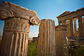 Ionic order fragment against Parthenon, Athenian Acropolis rear facade. Athens, Greece.