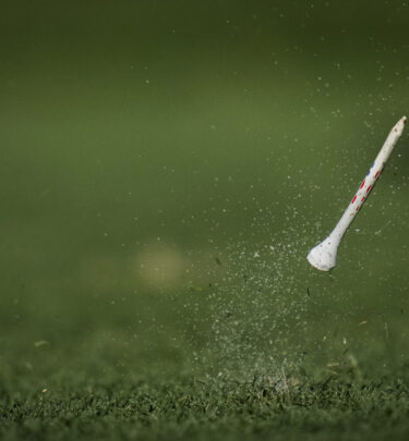 The wooden tee of United States' Cheyenne Knight bounces up after she plays her shot from the 9th tee during the afternoon fourball match at the Solheim Cup golf tournament in Finca Cortesin, near Casares, southern Spain, Saturday, Sept. 23, 2023. (AP Photo/Bernat Armangue)