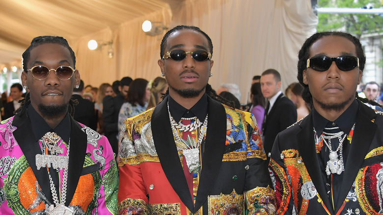 Migos posing at a gala