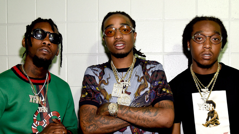 The Migos members wearing fancy chains