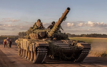 Ukrainian servicemen operate a Soviet-made T-72 tank in the Sumy region, near the border with Russia