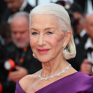 Helen Mirren wearing purple gown on red carpet