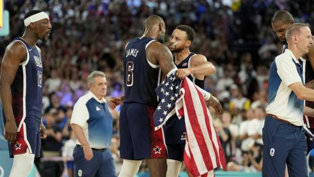 Paris, France; United States shooting guard Stephen Curry (4) and guard LeBron James (6) celebrate after defeating France in the men's basketball gold medal game during the Paris 2024 Olympic Summer Games at Accor Arena - Kyle Terada-USA TODAY Sports