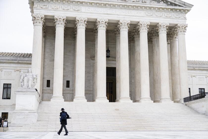 UNITED STATES - OCTOBER 3: Isaiah McKinney enters the U.S. Supreme Court as it begins a new term on Monday, October 3, 2022. The courts arguments had been closed to the public since March 2020 due to the coronavirus pandemic. (Tom Williams/CQ-Roll Call, Inc via Getty Images)