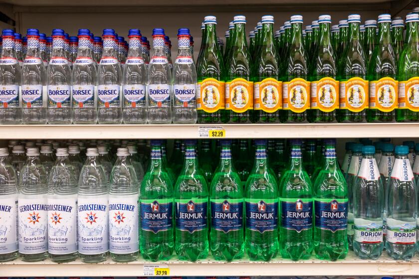 LOS ANGELES, CA - MAY 24: A partial selection of mineral water clockwise from upper left: Romania, Armenia, Georgia, Armenia, Germany at JONS. According to water sommelier Martin Riese, the best water in the city isn't found at any of the countless hip markets or grocery stores but at this family-owned grocery chain in the Los Angeles area that was founded in 1977 by Armenian immigrants. Photographed at JONS in Los Angeles, CA on Friday, May 24, 2024. (Myung J. Chun / Los Angeles Times)