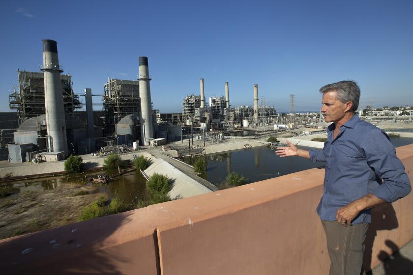 REDONDO BEACH, CA-NOVEMBER 22, 2019: Redondo Beach Mayor Bill Brand is photographed next to the AES Power Plant in Redondo Beach that is currently supposed to close in 2020 due to environmental regulations. California’s State Water Resources Control Board is considering a request from the Public Utilities Commission to allow this power plant to stay open longer. Brand is opposed to the extension. (Mel Melcon/Los Angeles Times)