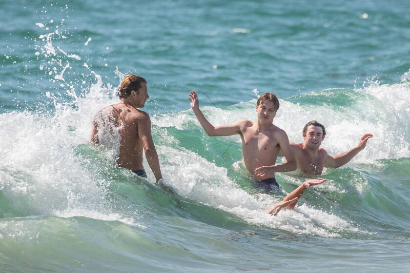 Hermosa Beach, CA - June 21: People body surfed in Hermosa Beach, CA, on the first day of summer, Wednesday, June 21, 2023. (Jay L. Clendenin / Los Angeles Times)