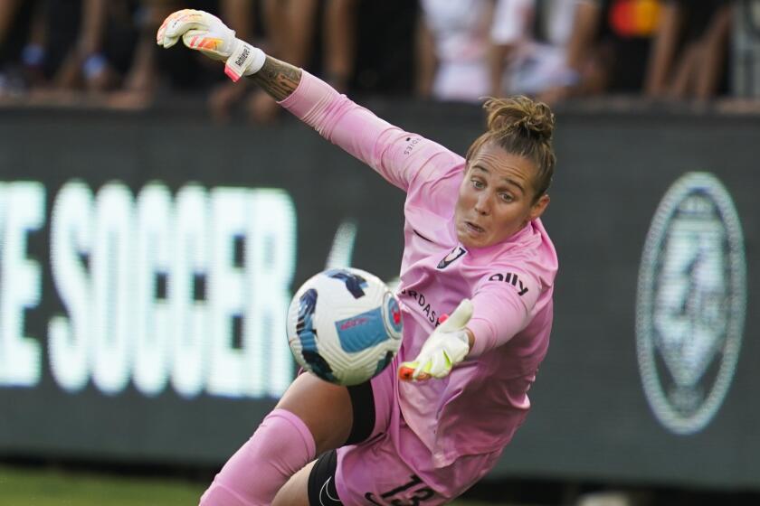 Angel City FC goal keeper Didi Haracic (13) stops a shot during the first half of an NWSL soccer.