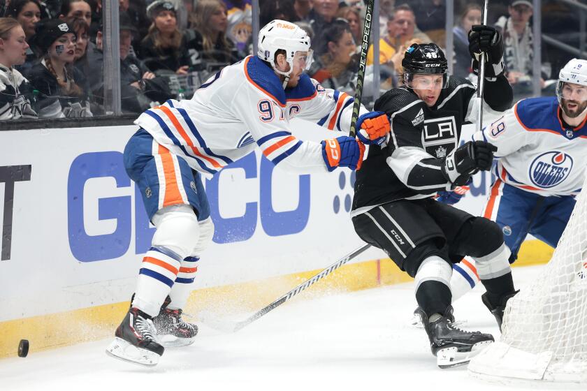 LOS ANGELES, CALIFORNIA - APRIL 26: Kings Blake Lizotte battles for the puck.