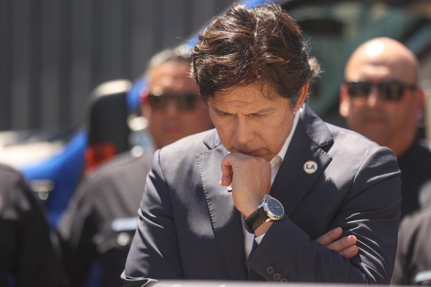 Los Angeles, CA - July 30: 14th District Los Angeles City Council Member Kevin de Leon listens while Command LAPD Officer Michael Oreb speaks about a recent copper wire bust on Tuesday, July 30, 2024 in Los Angeles, CA. (Michael Blackshire / Los Angeles Times)