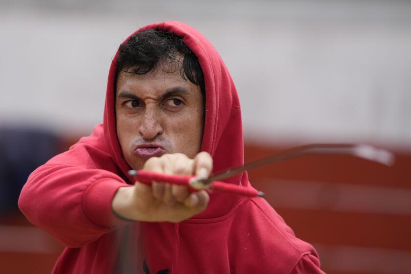 Colombian bullfighter Jose Luis Vega, 30, aims his sword as he trains at the bullring in Choachi, Colombia, Saturday, June 22, 2024. (AP Photo/Fernando Vergara)