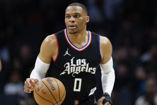 Clippers guard Russell Westbrook brings the ball up court against the Charlotte Hornets