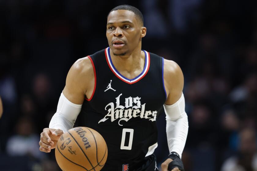 Clippers guard Russell Westbrook brings the ball up court against the Charlotte Hornets