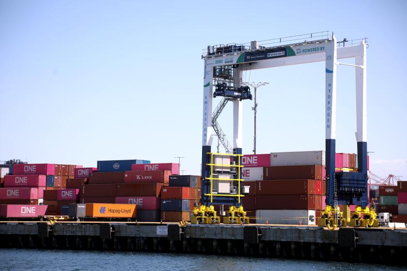 LOS ANGELES, CA - MARCH 14, 2024 - - A hydrogen powered crane, with zero emissions, waits to move cargo containers in Los Angeles Harbor on March 14, 2024. (Genaro Molina/Los Angeles Times)