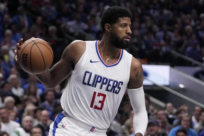 Los Angeles Clippers' Paul George works against the Dallas Mavericks in Game 2.