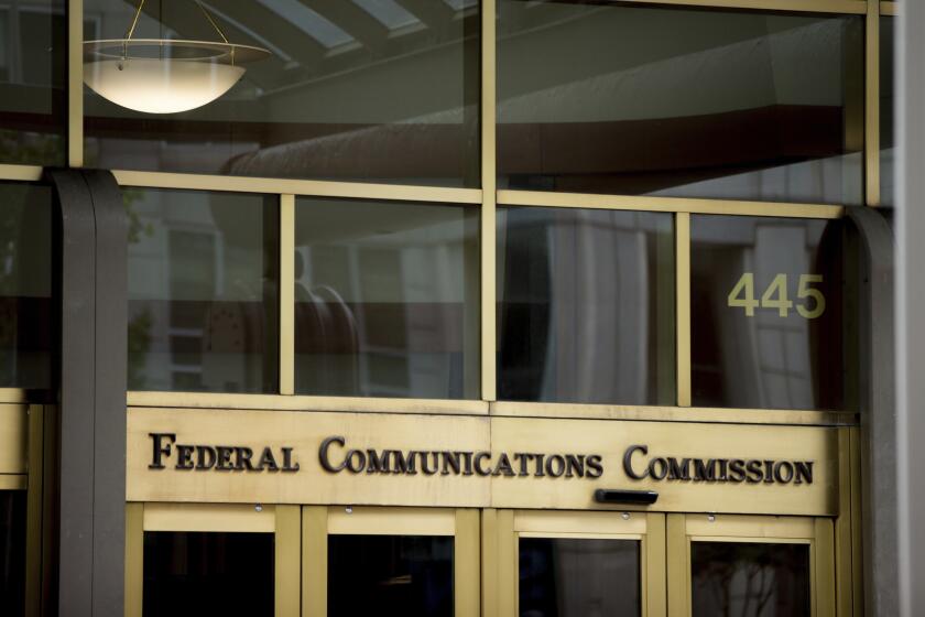 FILE - The Federal Communications Commission building is pictured, June 19, 2015, in Washington. (AP Photo/Andrew Harnik, File)