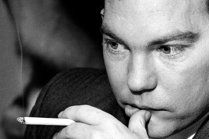 Lt. William Calley, Jr., smokes a cigarette as he waits in his quarters in Fort Benning, Ga. for a verdict from the six-officer court martial panel deliberating his case, March 27, 1971. Calley, of Miami, Fla., is charged with killing 102 Vietnamese three years ago at My Lai. The panel has been in deliberation for ten days without reaching a verdict. (AP Photo/Joe Holloway, Jr.)