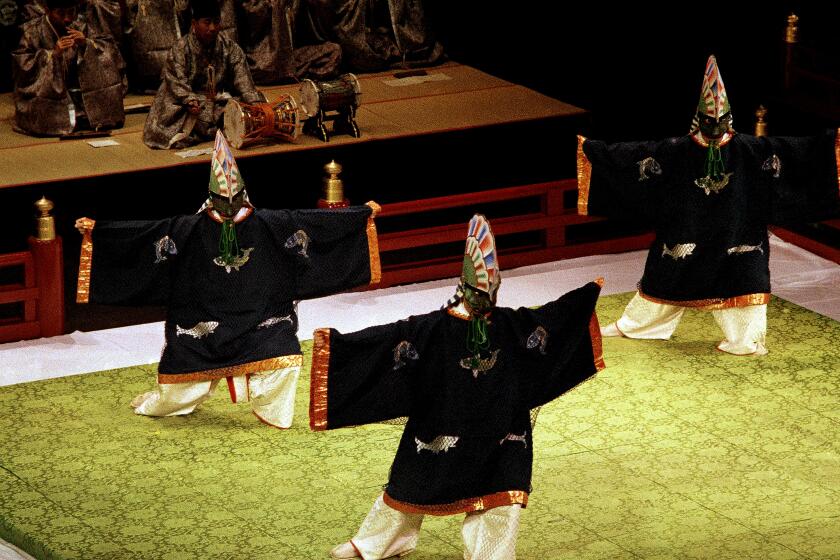 Japanese dancers in traditional costumes perform July 20, 1984, as part of the Olympic Arts Festival in Los Angeles.